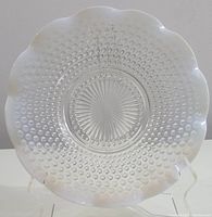 Top view of the opalescent hobnail glass platter showing overall pattern and scalloped edges.
