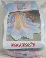Front and close-up image of Mary Maxim Peaceful Pastels Afghan Kit in sealed plastic package showing pastel yarn skeins and product label with finished afghan image