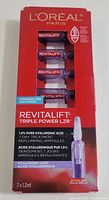 Front view of the new L'Oreal Paris Revitalift Triple Power LZR 7-Day Treatment box showing 7 ampoules and branding.