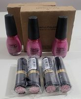 Six bottles of Sinful Colors nail polish Jam Out with 3 lipsticks visible in front.