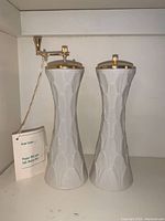 Full view showing both Lenox pepper mill and salt shaker with original tag