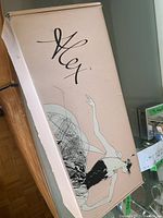 Box branded with 'Alex' logo showing.