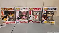 Group of four Funko Pop vinyl figures from the Ad Icons collection in original boxes: Chester Cheetah, Energizer Bunny, Coca-Cola Polar Bear, Pez Girl.
