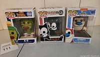Photo showing all three Funko Pop! figures in box, K-9, Felix the Cat, and Stimpy
