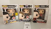 Three boxed Funko Pop! NHL hockey figures of Jonathan Toews, Sidney Crosby, and Wayne Gretzky displayed side by side.