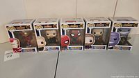 Full set of 5 Funko Pop boxes with figures from Marvel Avengers Infinity War showing Iron Man, Thor, Iron Spider, Captain America, and Thanos.