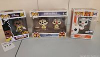 Front view of three boxed Pop! vinyl figures: Powerline, Chip and Dale 2-pack, and Lucky.