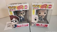 Two boxed Funko Pop! vinyl figures from Austin Powers series: Austin Powers #643 and Dr. Evil #644 side by side.