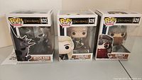 Front and side view of three boxed Funko Pop! figures: Witch King #632, Legolas #628, Gimli #629.