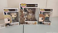 Three Lord of the Rings Pop! Movies vinyl figures inside their original boxes: Merry Brandybuck (#528), Treebeard 6" (#529) with visible box damage, and Pippin Took (#530).