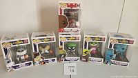 All seven Funko Pop! figures in their original boxes including characters from Space Jam and a Michael Jordan special edition.