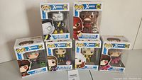 Overview photo of all six boxed Funko Pop! X-Men figures: Kitty Pryde, Juggernaut, Colossus, Rogue, and two Gambit variants.