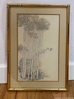 Full view of the framed print showing bamboo style frame, double matting, and image of bamboo trees with birds.