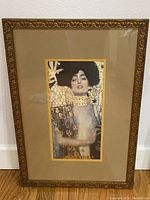 Full view of the framed print showing the detailed decorative frame and double matting.