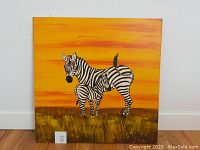 Square oil painting of a zebra and calf in grass with bright orange sky background.