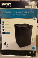 Original packaging box showing Danby branding, model number, and key specs including 4.4 cubic feet capacity and black color.