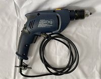 Full view of Mastercraft corded hammer drill with power cord and attached chuck