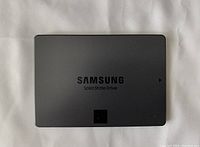 Top side of Samsung SSD showing Samsung logo and 'Solid State Drive' text.
