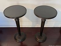 Front view of both tables side by side on hardwood floor against wall