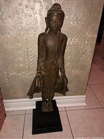 Full front view of statue and base
