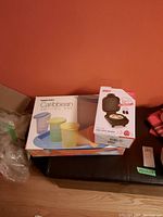 Tupperware Caribbean serving set box with colorful cups on a tray