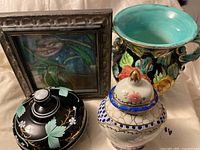 Overall lot showing painting, black dish, majolica vase and porcelain ginger jar