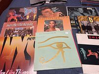 Group shot of eight record jackets laid out