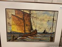 Front view of framed watercolour showing sailboats at sea