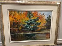 Full view of framed painting showing artwork and frame