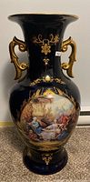 Full view of navy blue Limoges vase showing size, shape and painted scene