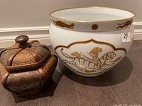 Jardiniere and spice jar side by side