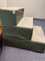 Side view of grey three-step pet stairs