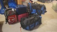 Group photo of all five bags showing the variety and color of bags