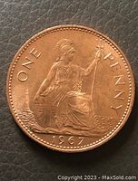 Reverse side of the 1967 British one penny coin showing Britannia seated with trident and shield, year 1967 below.