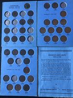 Four blue album panels and informational sheet laid out