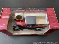 Front view of the collectible diecast truck in original box showing the truck and packaging details.