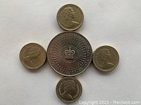 Obverse side of the coins showing Queen Elizabeth II's portrait on all coins with varying designs and dates.