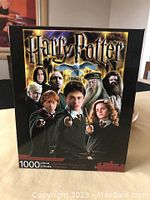 Front of the box showing Harry Potter and several main characters from the series with puzzle piece count of 1000.