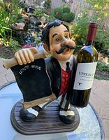 Front-side image showing the vintage man wine bottle display stand holding a 'House Wine' scroll and a wine bottle.