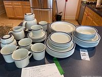 Full service and serving pieces arranged on countertop