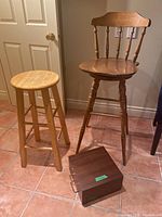 Photo showing both stools and the small wooden box on tiled floor.