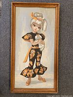 Full view of vintage paint by number painting of girl holding dog in a wooden frame.
