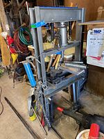Full front view of steel shop press frame with bottle jack installed and press plates attached