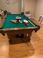 Full view of pool table and all accessories arranged on playing surface