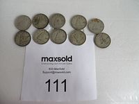Photo showing all ten Canadian silver dimes arranged on a white surface with maxsold lot number card.