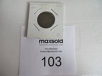 Front view of 1899 Silver Newfoundland 20 cent coin in protective cardboard holder.