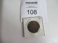 Full view of the 1917 Newfoundland 50 cent silver coin in holder with identifying notes