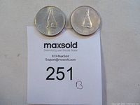 Two 1967 silver 50 cent coins showing the wolf design on the obverse side, placed above a MaxSold label with lot number 251B.