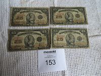 Four Dominion of Canada 25 cent shinplaster notes displayed showing fronts with serial numbers and signs of use.