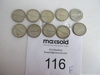 Top side of 10 Canadian 1967 silver dimes showing fish design, all circulated
